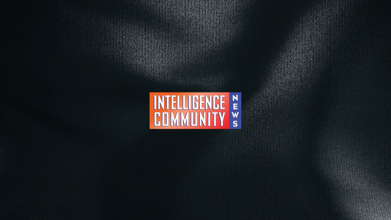 Black and white textured background with the Intelligence Community News logo centered.